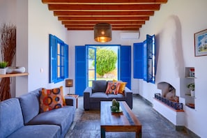 Executive Villa, 3 Bedrooms, Private Pool, Beachfront | Living room | LED TV, fireplace