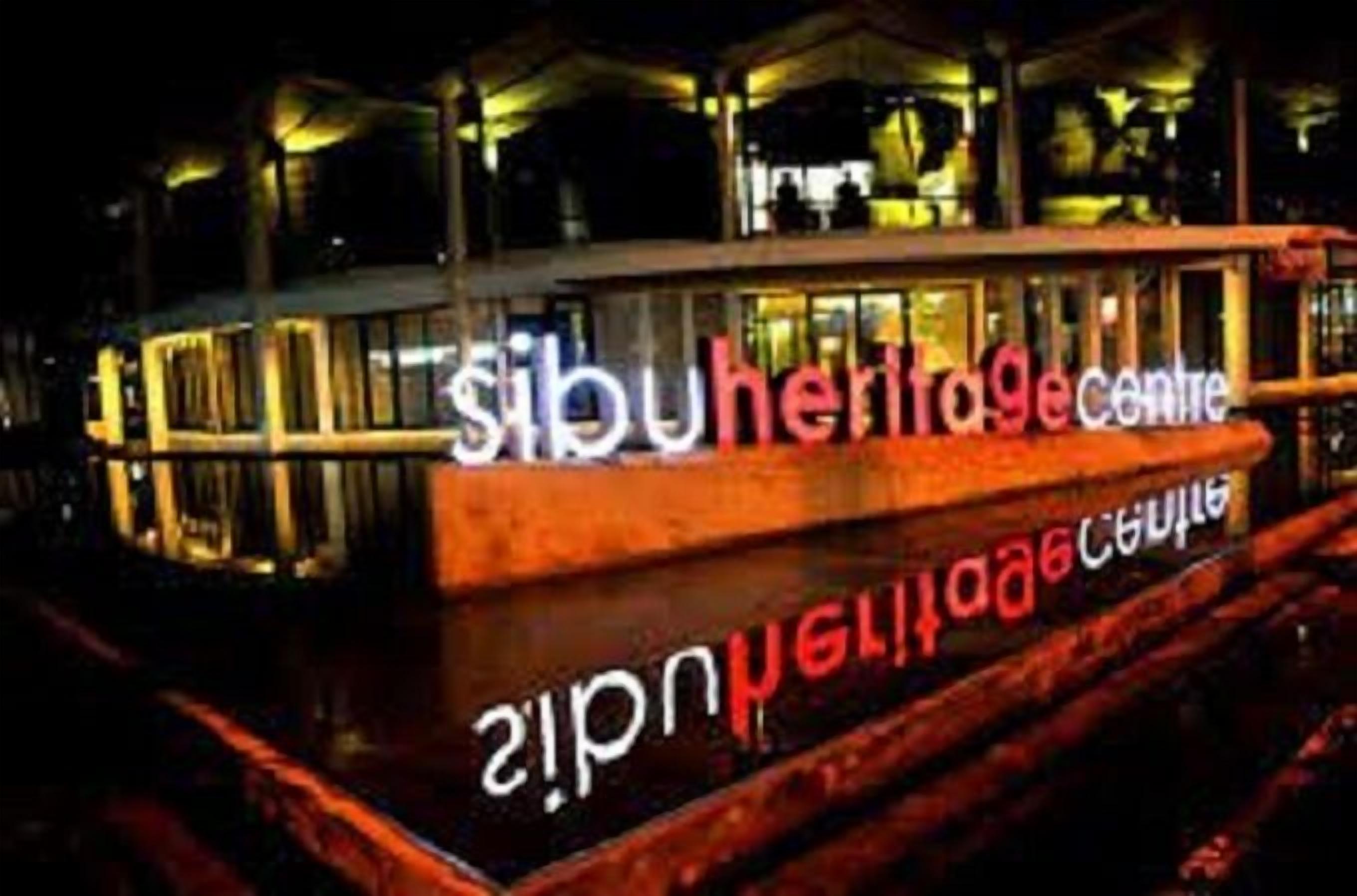 A boat with the text "Sibu Heritage Centre" on its side.