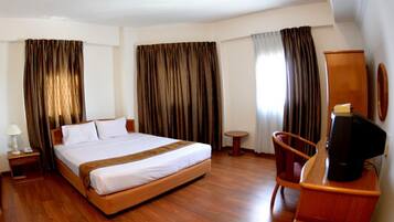 Desk, blackout curtains, iron/ironing board, bed sheets