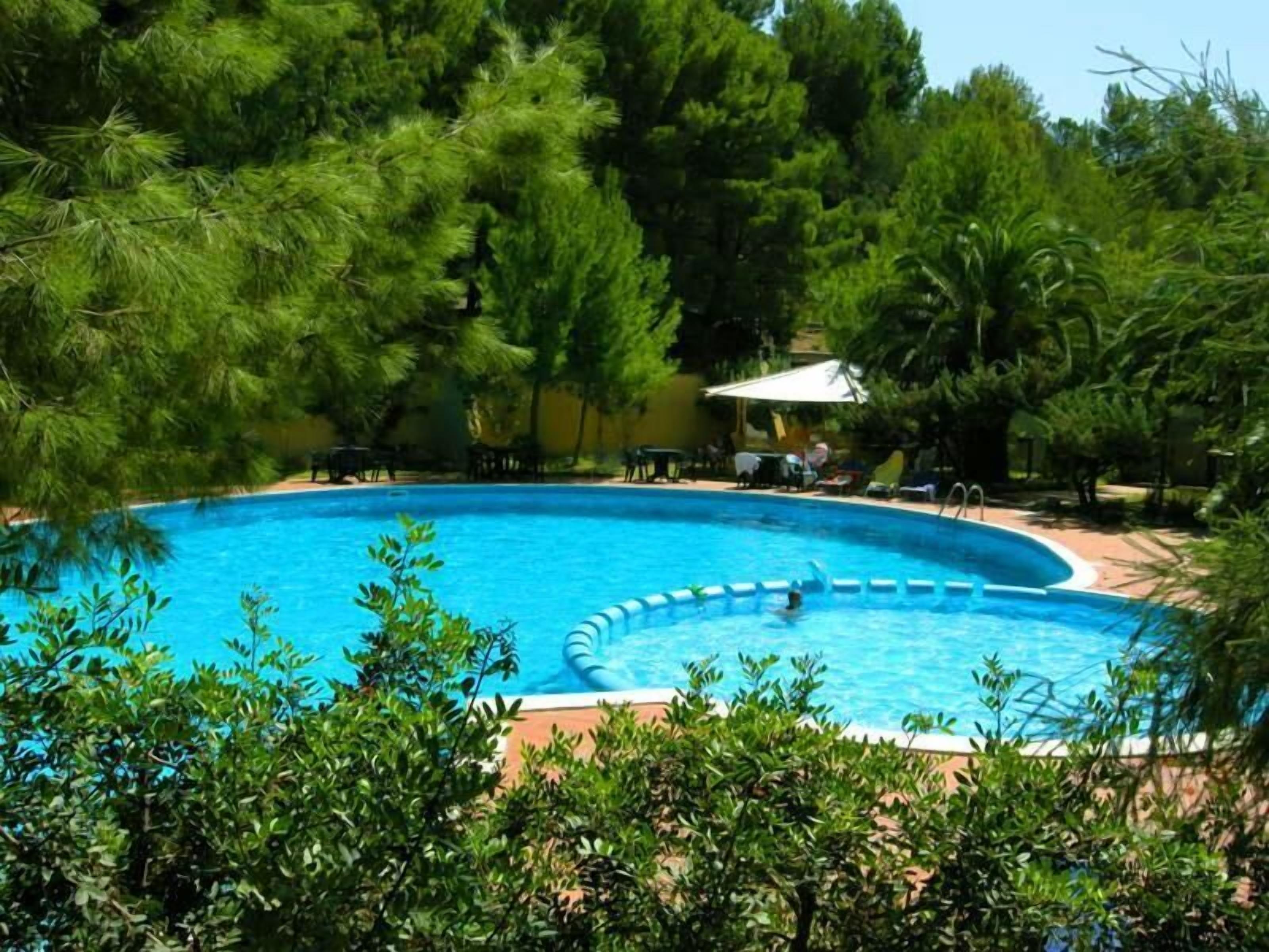Seasonal outdoor pool, open 10:00 AM to 7:00 PM, sun loungers