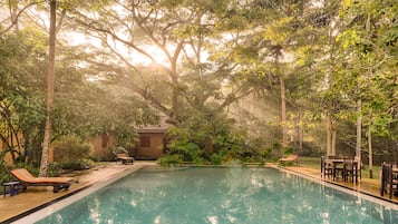 Outdoor pool, open 7:00 AM to 9:00 PM, pool umbrellas, pool loungers