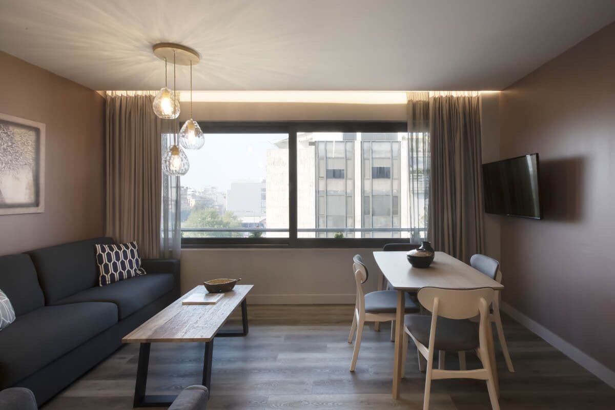 Apartment, 1 Bedroom (Street View) | Living area | Flat-screen TV