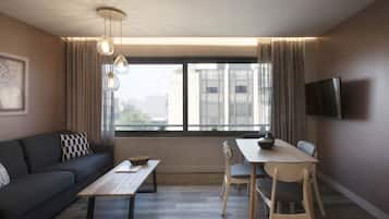 Apartment, 1 Bedroom (Street View) | Living area | Flat-screen TV