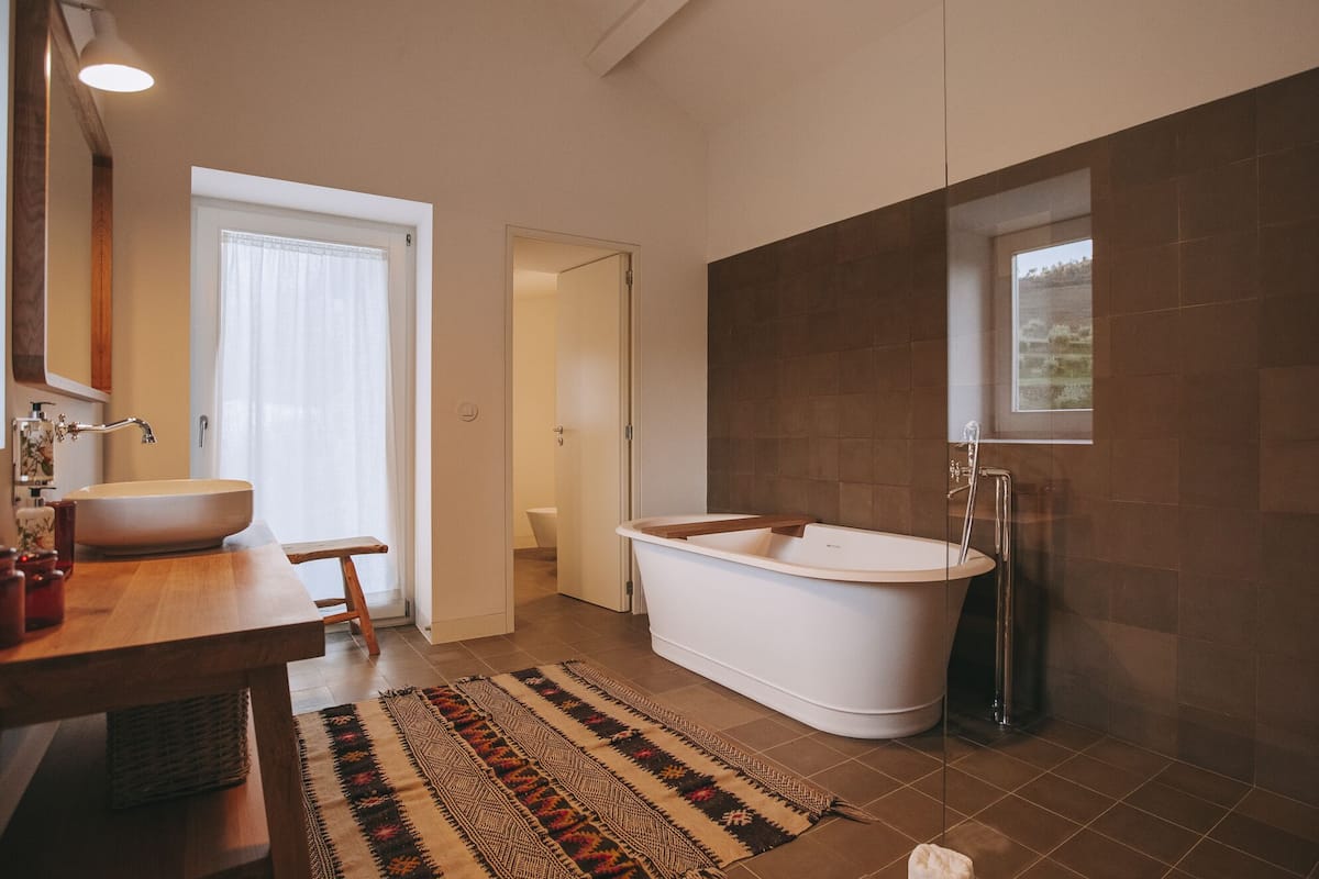 junior suite | bathroom | hair dryer, bathrobes, slippers, towels
