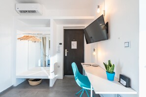 Estúdio | Área de estar | TV de tela plana