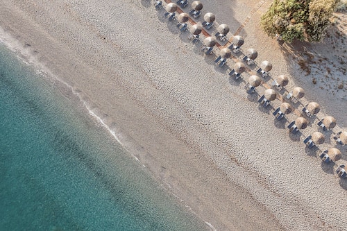 On the beach, sun-loungers, beach umbrellas, beach towels