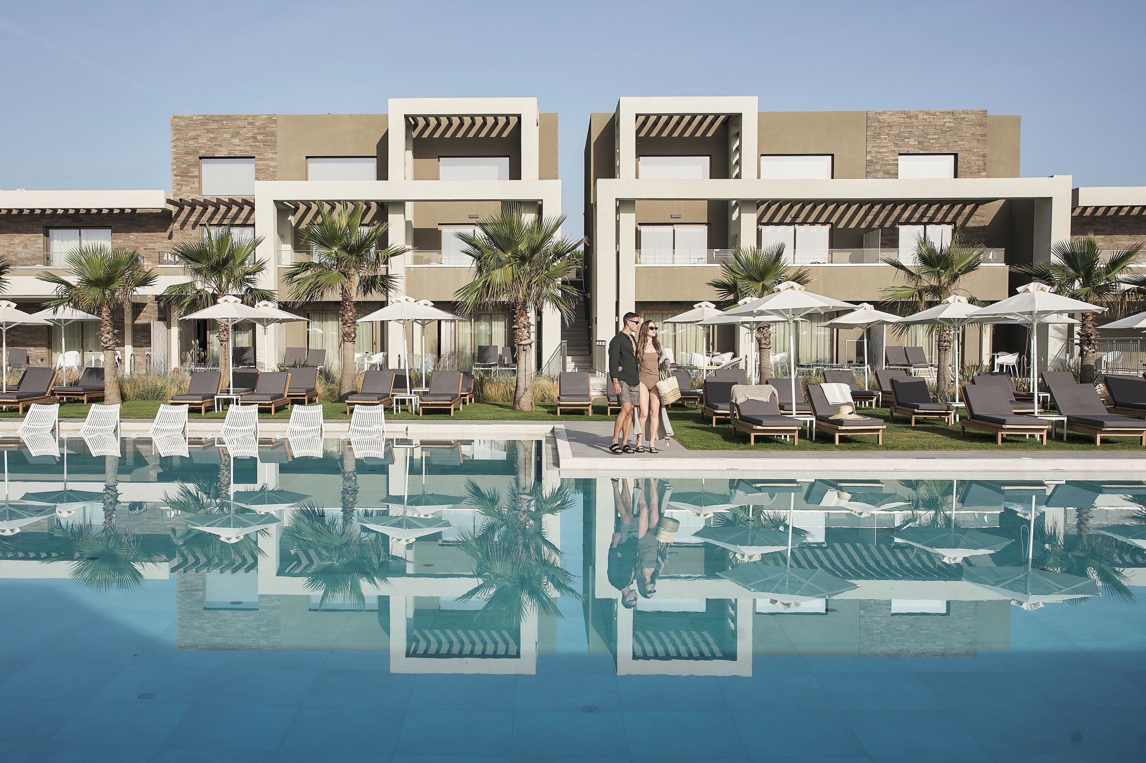 indoor pool, outdoor pool, pool umbrellas, pool loungers