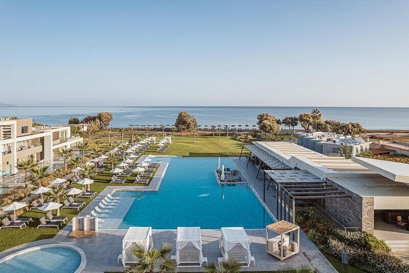 Indoor pool, outdoor pool, pool umbrellas, pool loungers
