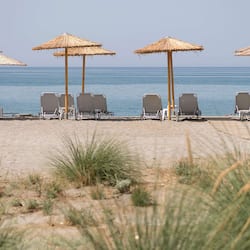 On the beach, sun-loungers, beach umbrellas, beach towels