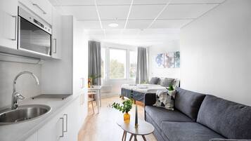 Luxury Studio Suite | Living area | Plasma TV