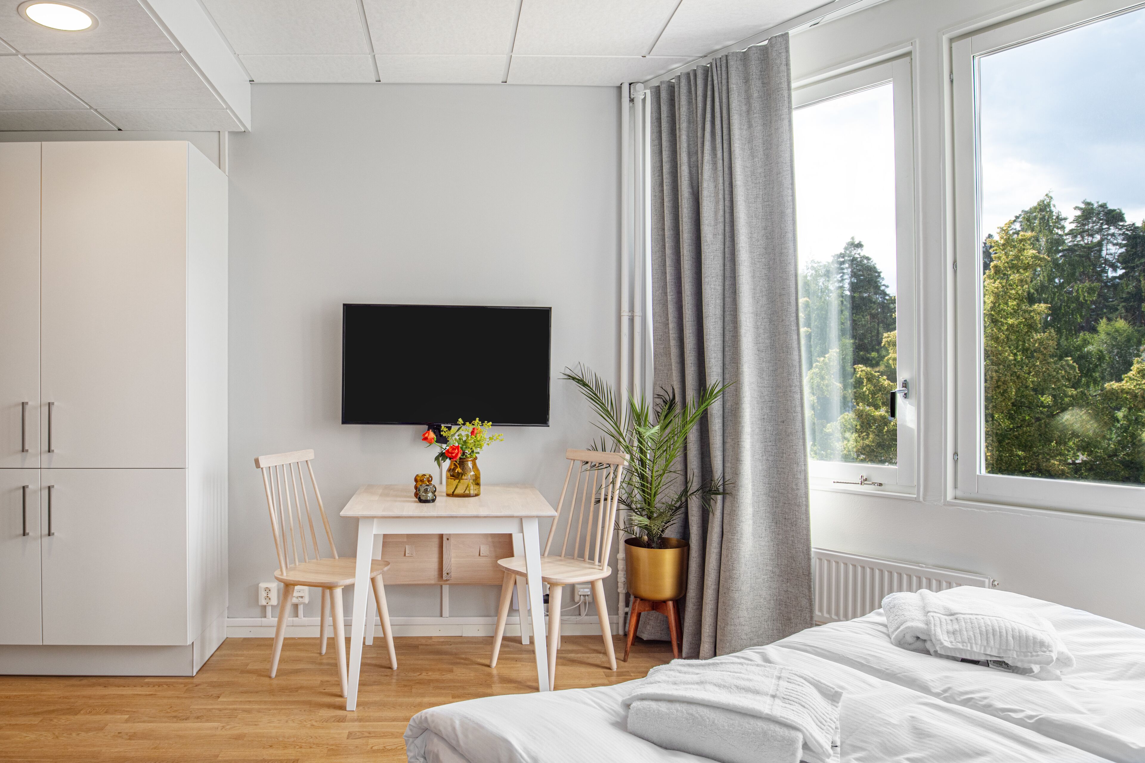 luxury studio suite | living area | plasma tv