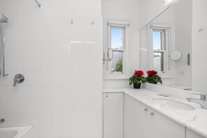 Shower, hair dryer, towels, shampoo