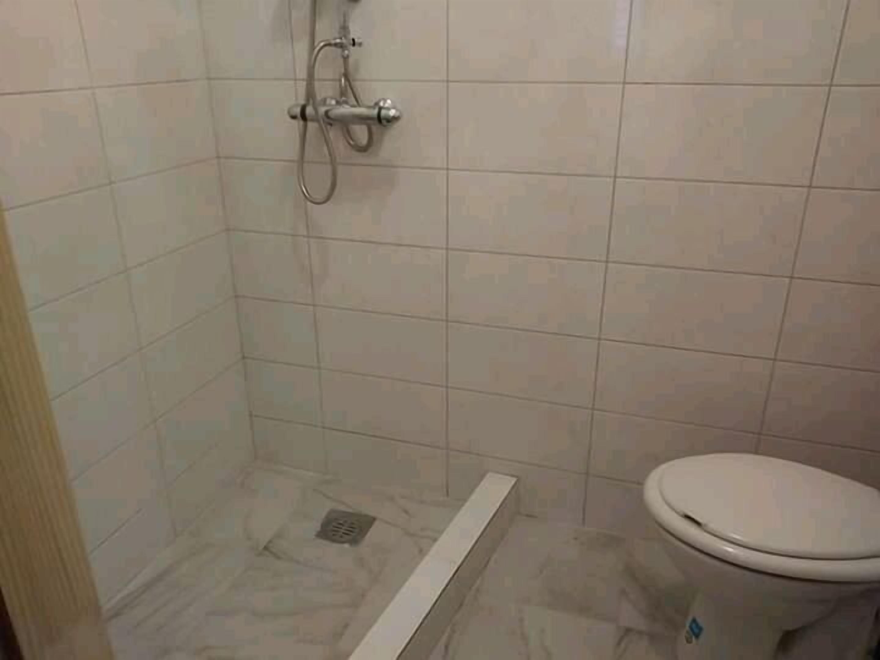 Family Room with Shower | Bathroom | Shower, towels, soap, toilet paper