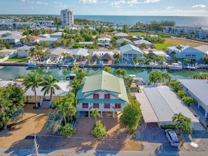 A coastal residential area with houses, a marina, and a view of the ocean. - P64 - Spacious 3 bedroom duplex in Key Colony with dockage and Cabana Club Access! (Key Colony Beach)