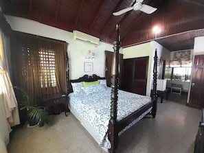 Basic Room, 1 King Bed, Pool View | Pillowtop beds, in-room safe, individually decorated, blackout drapes