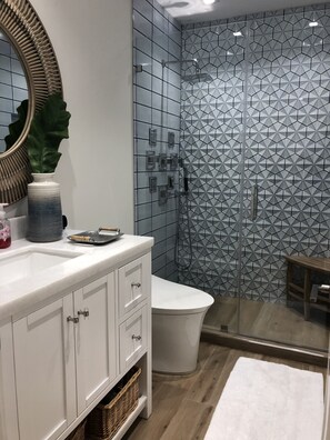 Shower, hair dryer, towels, toilet paper