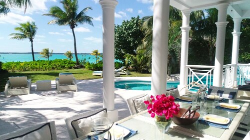 Stunning waterfront property with panoramic sunset views + pool + dock