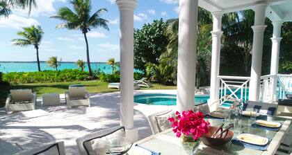 Stunning waterfront property with panoramic sunset views + pool + dock