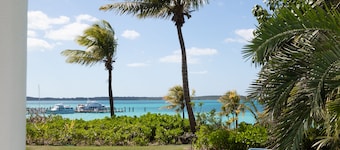 Stunning waterfront property with panoramic sunset views + pool + dock