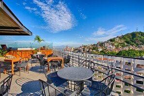 Outdoor dining - Chic, Spacious Condo | Great Walkability, Pool, Gym, Rooftop Views (Puerto Vallarta)