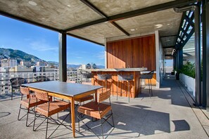 Outdoor dining - Chic, Spacious Condo | Great Walkability, Pool, Gym, Rooftop Views (Puerto Vallarta)
