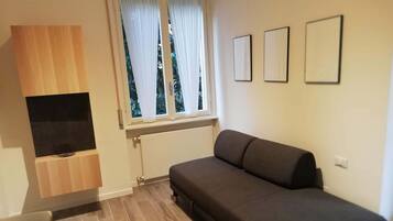 Apartment, 1 Bedroom | Living area | Flat-screen TV