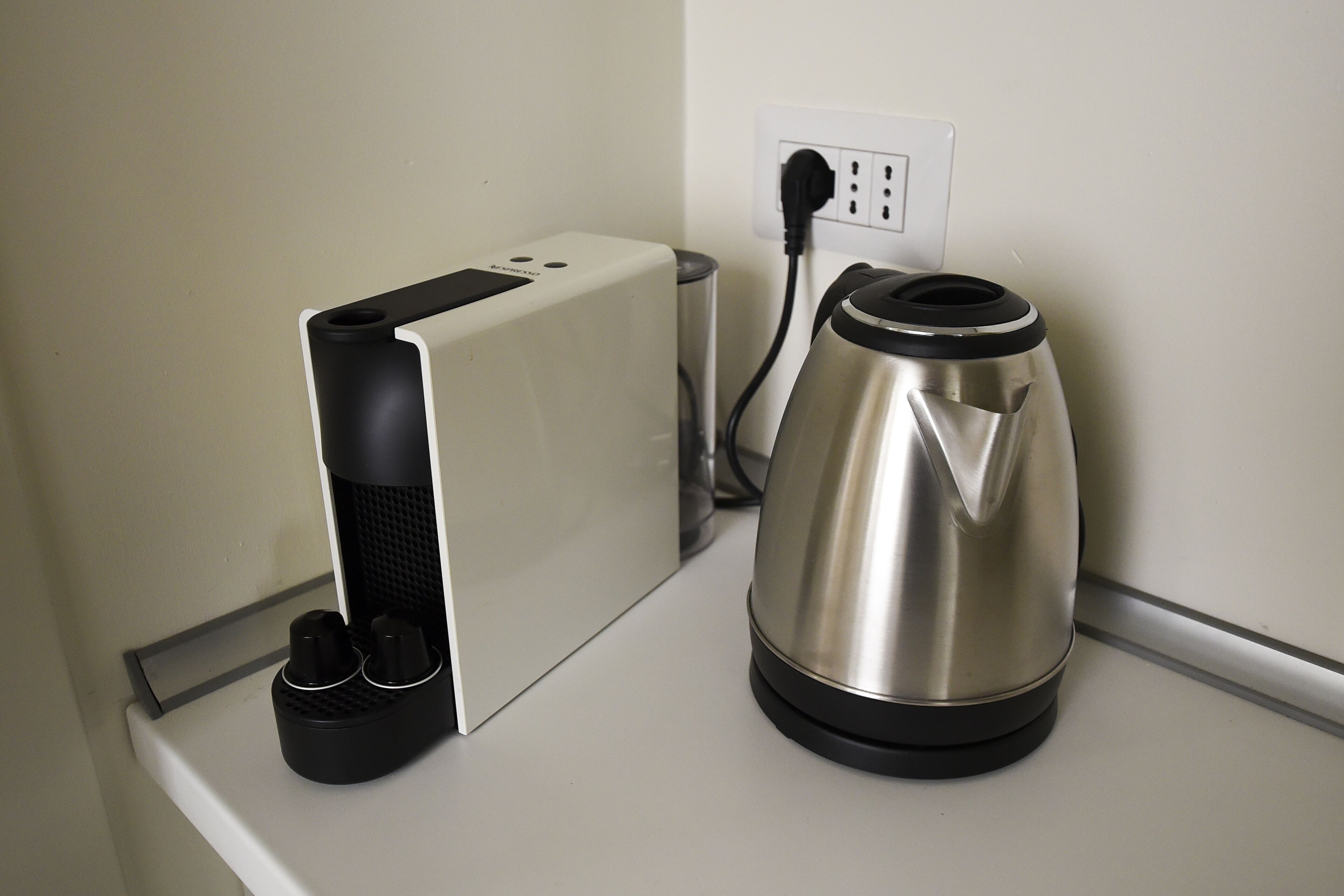 A kitchen counter with a coffee maker and a toaster.