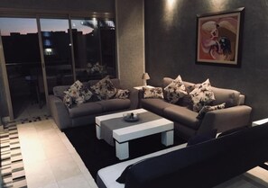Apartment, 2 Bedrooms | Living area | Flat-screen TV