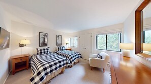 A bedroom with two beds, a chair, a desk, and a wardrobe. - Cottonwood Condo 1413 - Near Ice Rink 3BR Condo in Sun Valley (Sun Valley)