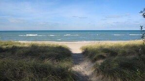 A beach path leading to the ocean with grassy dunes. - 2027 NOW OPEN! UNION PIER HOME, PRIVATE ASSOCIATION BEACH ACCESS, HOT TUB! (Union Pier)