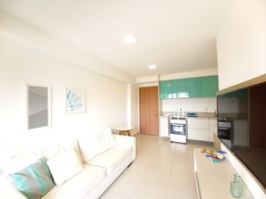 Family Apartment, Courtyard View, Beachside | Living area | 32-inch Smart TV with satellite channels, TV - Flats no Cupe Beach Living (Ipojuca)