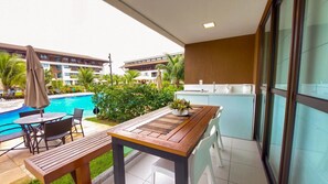 Family Apartment, Pool View, Ground Floor | Outdoor dining - Flats no Cupe Beach Living (Ipojuca)