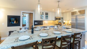 A modern kitchen with a large island, stainless steel appliances, and pendant lighting. - Christel - Peaceful West End Home, Downtown Telluride, Walk to Ski (Telluride)