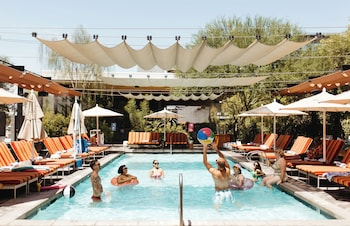 Outdoor pool, cabanas (surcharge), pool umbrellas at Rise Uptown Hotel 