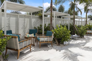 Outdoor pool, open 9:00 AM to 10:00 PM, sun loungers at Compass Hotel by Margaritaville Anna Maria Sound