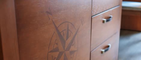 A wooden dresser with a compass design.