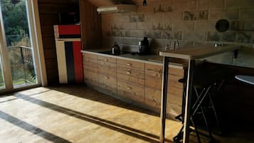 Fridge, microwave, cookware/dishes/utensils, dining tables