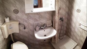 Apartment, 1 Bedroom | Bathroom | Shower, hair dryer, towels, soap