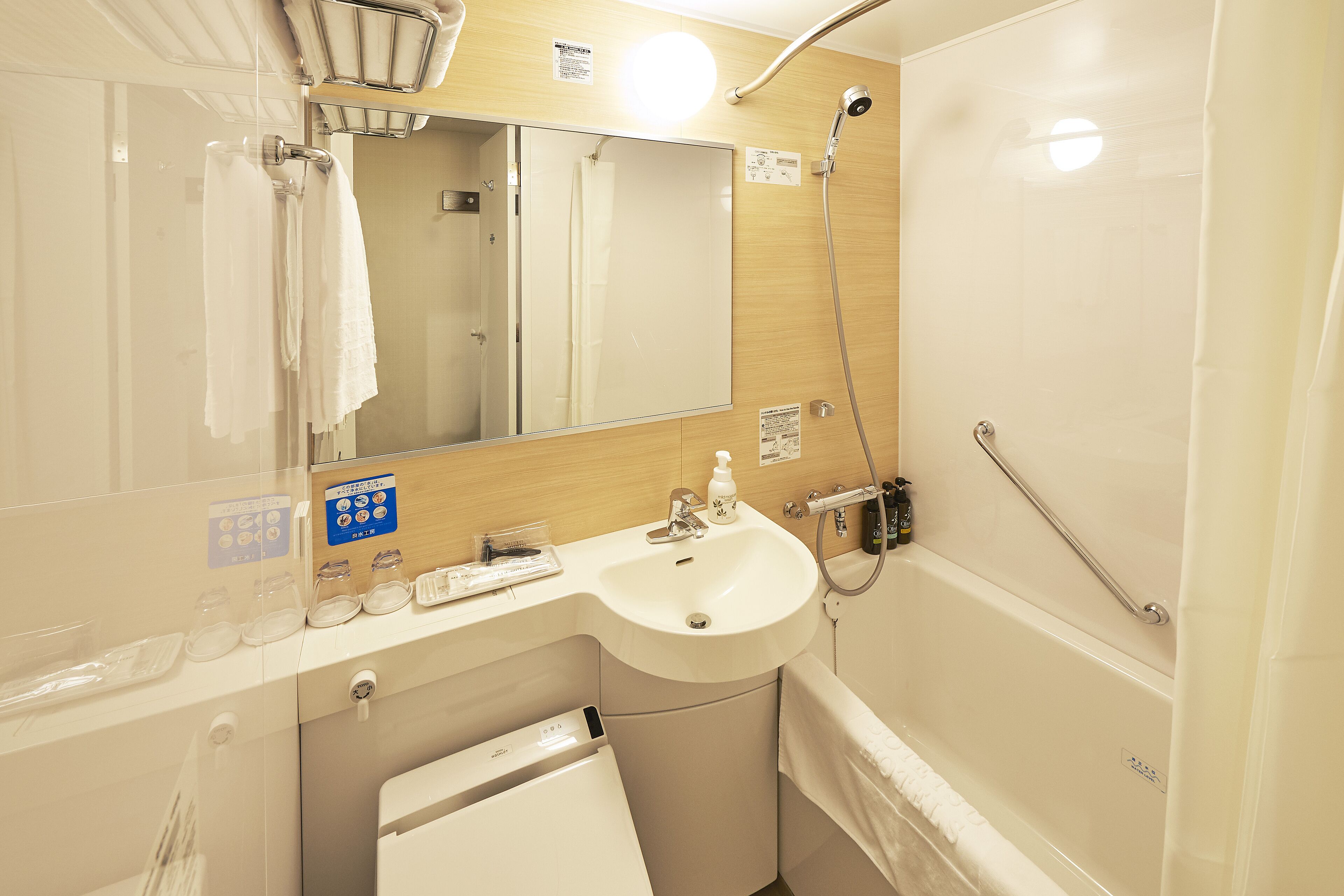 combined shower/bathtub, deep-soaking bathtub, hair dryer, slippers