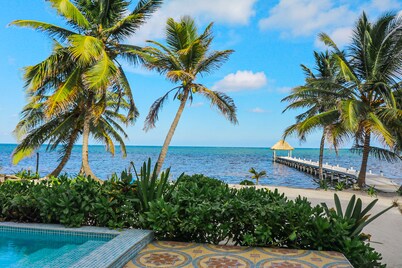 Serene oceanfront condo with shared pool, ocean view, WiFi, & partial AC