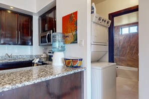 Fridge, microwave, oven, stovetop - Serene oceanfront condo with shared pool, ocean view, WiFi, & partial AC (San Pedro)