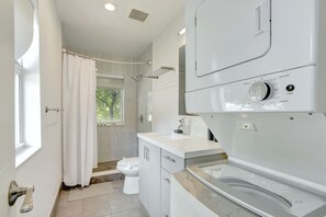 Shower, hair dryer, towels, shampoo
