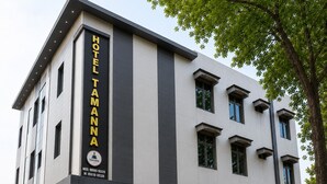A modern hotel building with a prominent vertical sign reading 'HOTEL TAMANN'. - Hotel Tamanna 2 Minute Walk from Golden Temple (Amritsar)