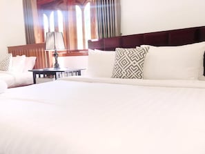 Phòng 3 Deluxe, nhiều giường, quang cảnh vườn | Bộ đồ giường cao cấp, nệm có lớp đệm bông, minibar 