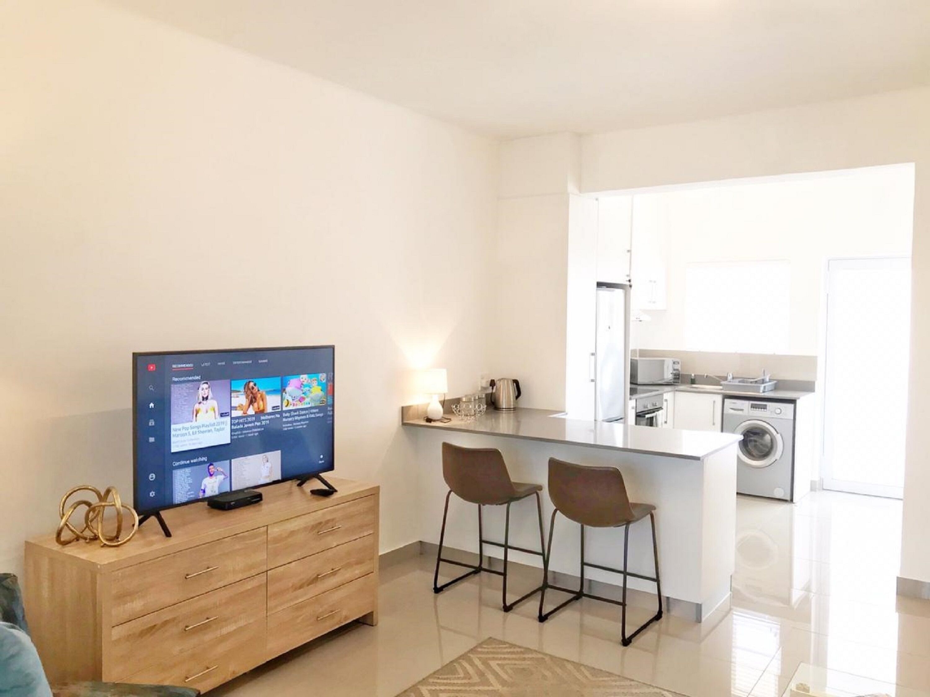 Apartment (1 Bedroom) | Living area | 65-inch flat-screen TV with satellite channels, Smart TV, Netflix