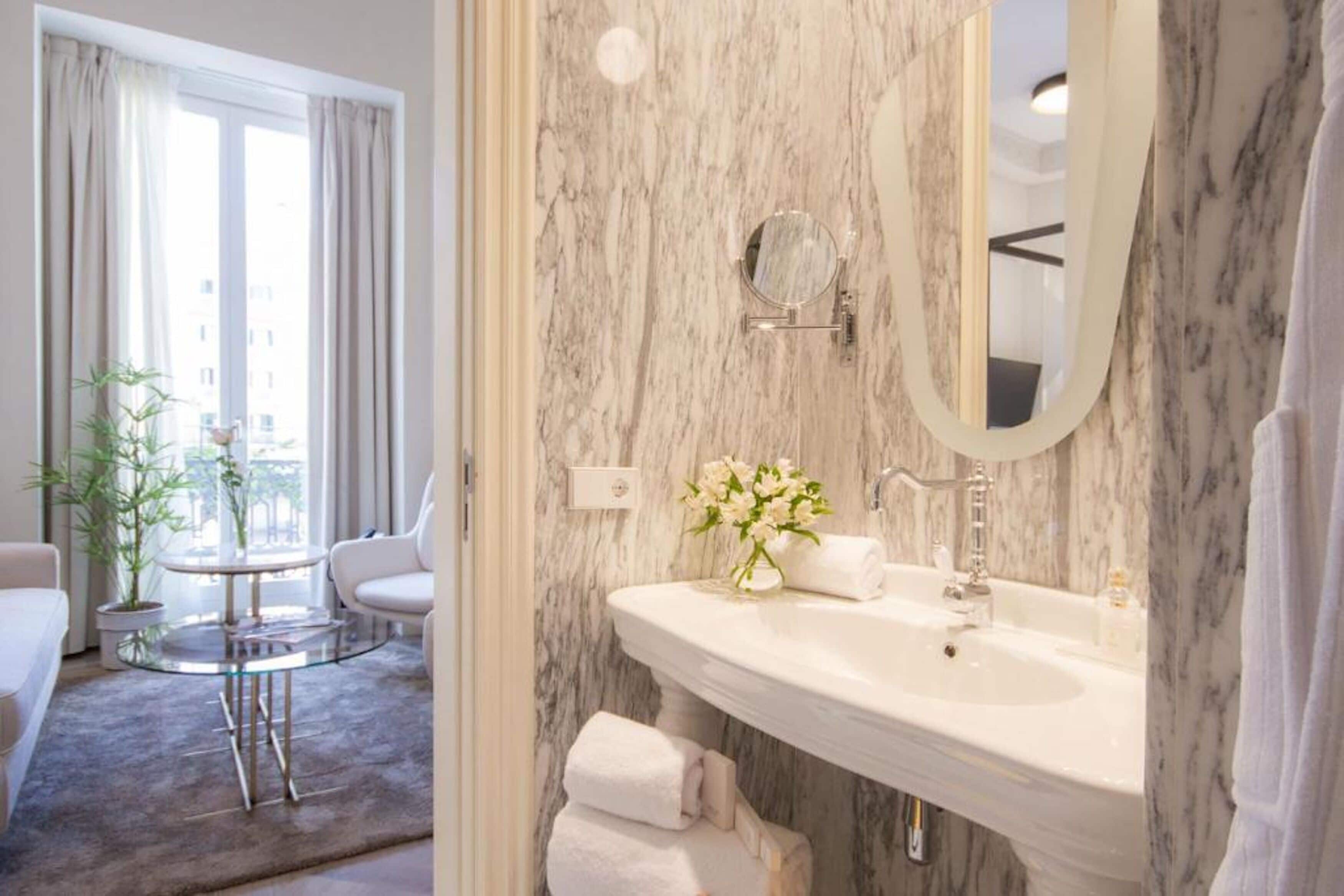 junior suite | bathroom | shower, free toiletries, hair dryer, bathrobes