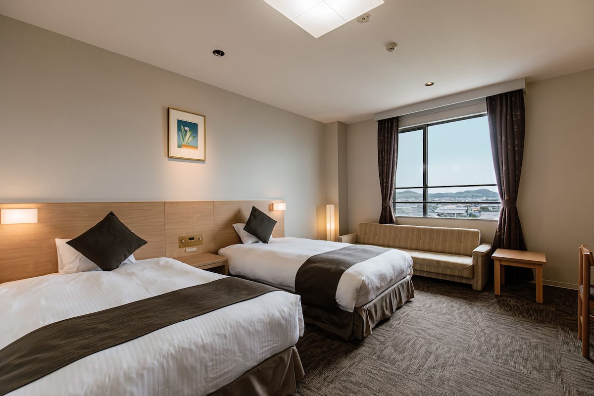 Standaard Twin kamer, niet-roken (With Sofa Bed) | Een kluis op de kamer, beddengoed