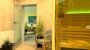 Relax in a comfortable space with a dining area, seating nook, and peaceful greenery.