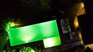 An aerial view of a swimming pool with a surrounding deck area. - Three Bungalows in the sun (NOSY-BE,)