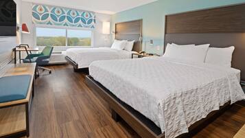 Premium bedding, desk, laptop workspace, blackout drapes